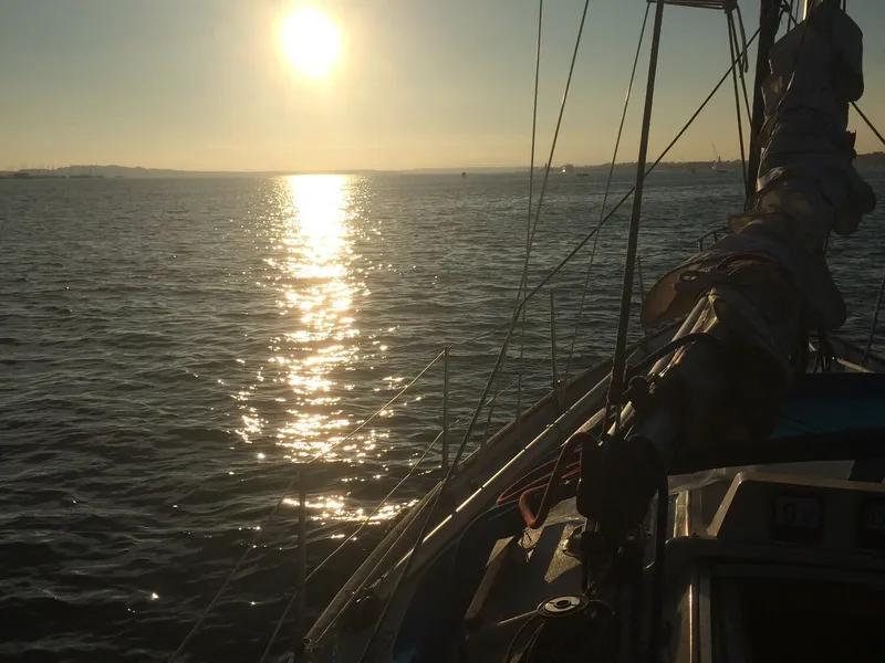 Liamar sailing at sunset with dramatic lighting